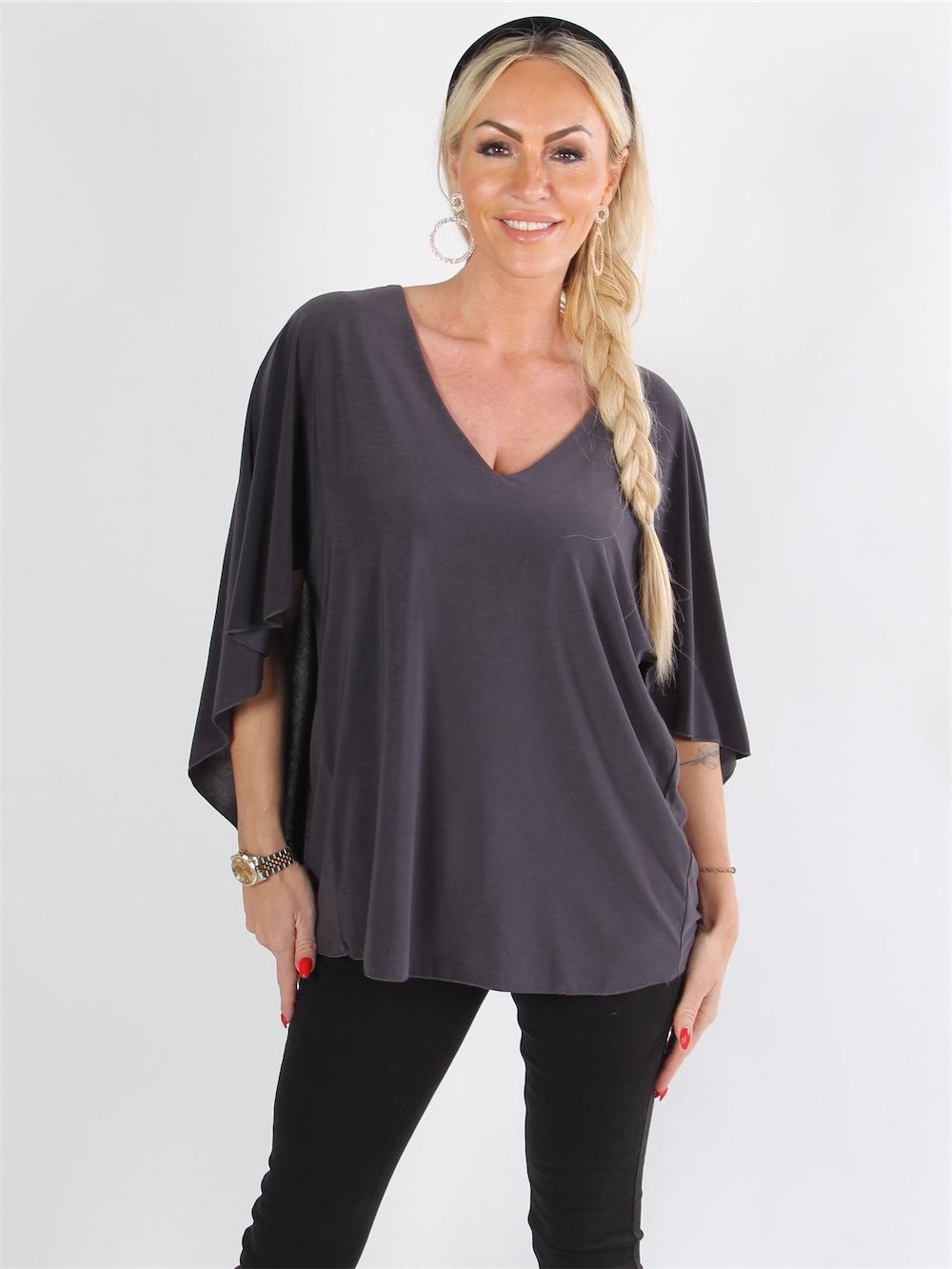 Jovana - Fin blus med fladdermusärmar och låg rygg
